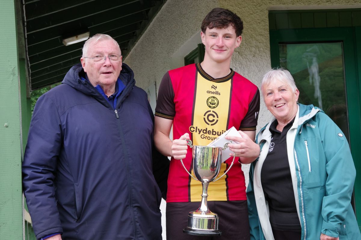 NO T28 DK Lafferty Cup Partick Thistle captain Liam Rooney receives the DK Cup from Mrs Frances Black and tournament organiser David Buchanan Photo Derek Black web