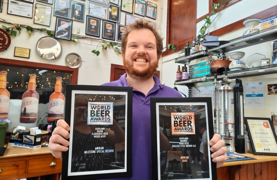 Arran Brewery’s head brewer, Yorick Hinchliffe, with some of the awards won over the last 26 years. Photograph: Arran Brewery.