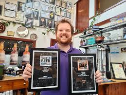 Arran Brewery’s head brewer, Yorick Hinchliffe, with some of the awards won over the last 26 years. Photograph: Arran Brewery.