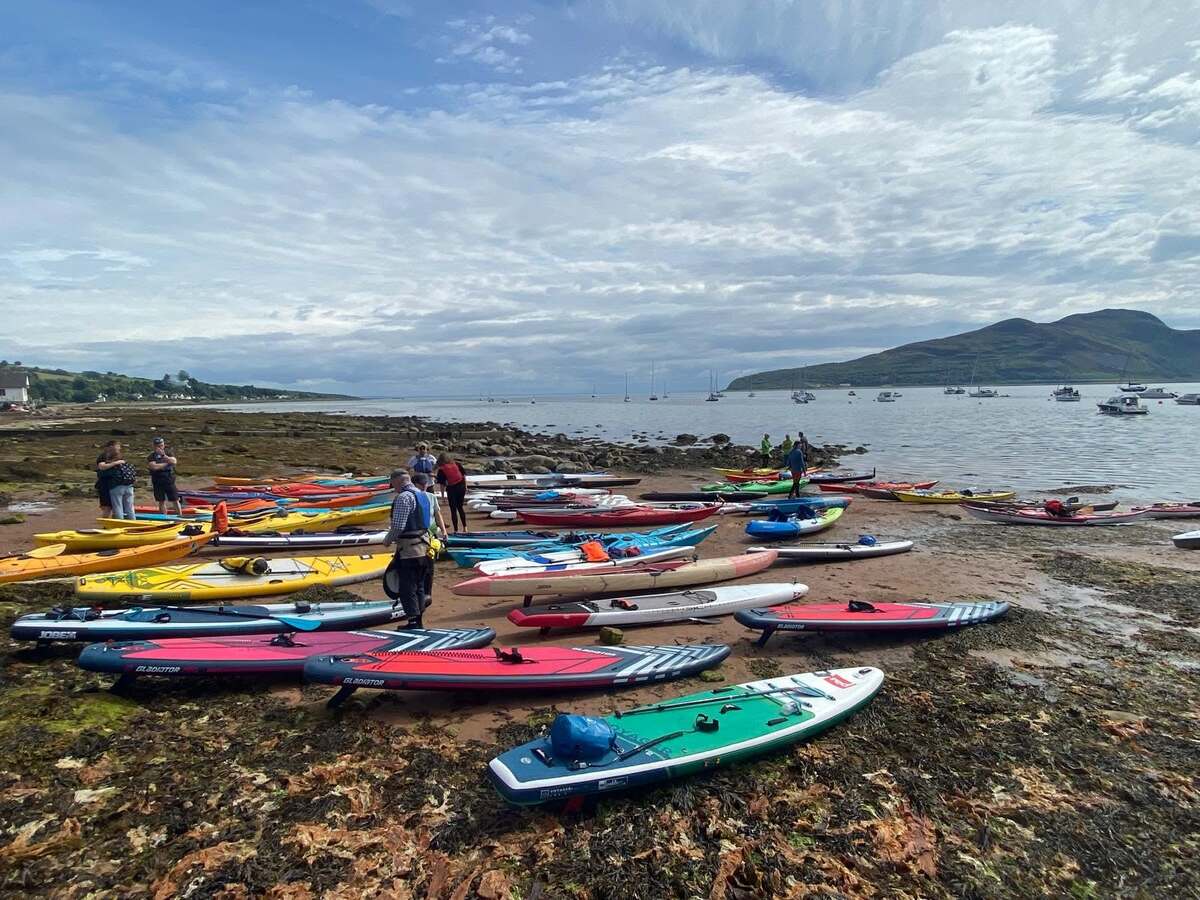 Craft of all kinds line up on the beach in preparation for a previous Holy Isle Challenge. Photograph: Otter’s Tail. 
