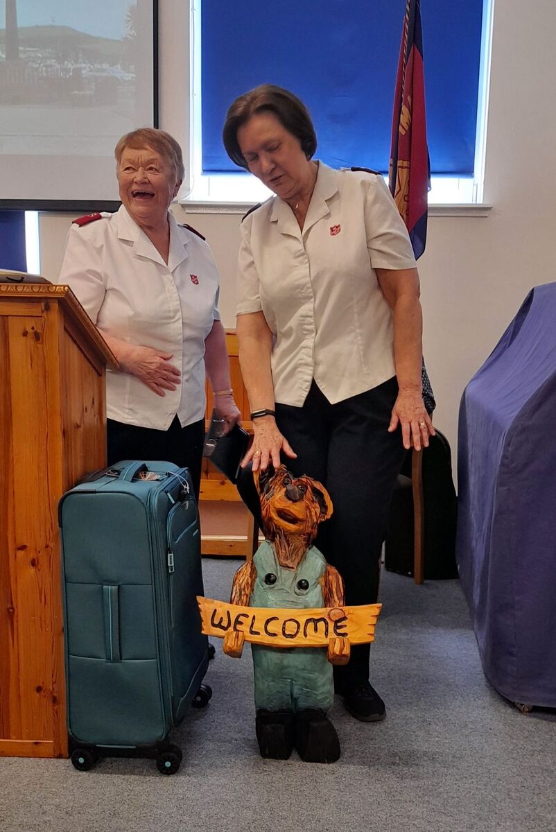 Captain Victoria McLachlan presenting Major Ruth Russell with a farewell gift on behalf of the Campbeltown corps.