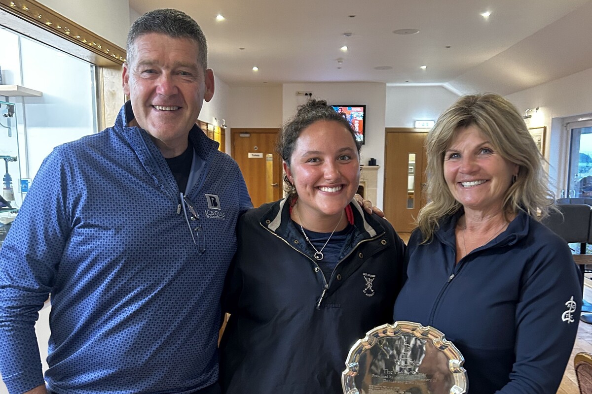 Andrew Malcolm and Shona Weir being presented with Shiskine Golf Club&rsquo;s Penny Salver by Grace Penny. Photograph: SGTC. 