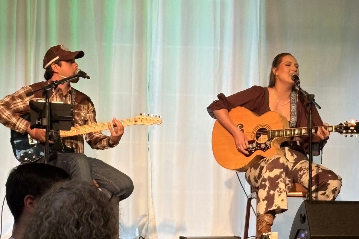 Ella Hartwig and her touring partner, guitarist Dylan Coles, on stage.
