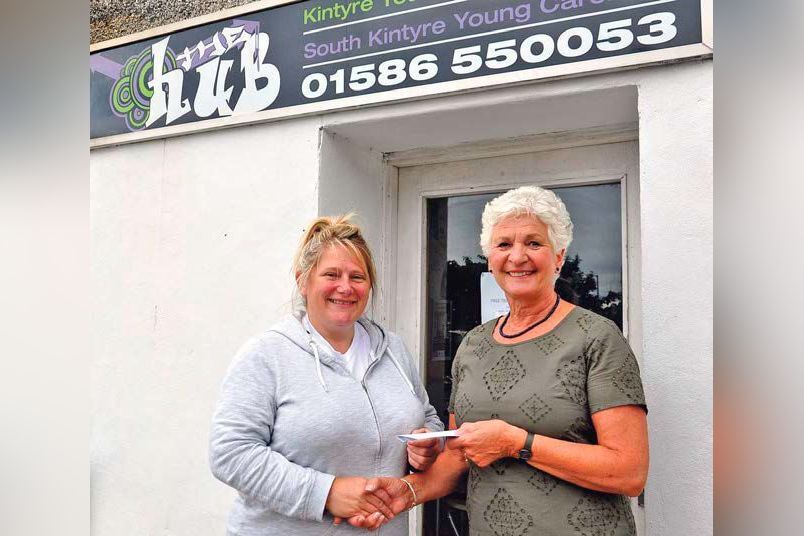 2016: Mandy Robertson, left, of The Hub receiving the donation from Machrihanish Golf Club&rsquo;s lady captain, Alison Fox.