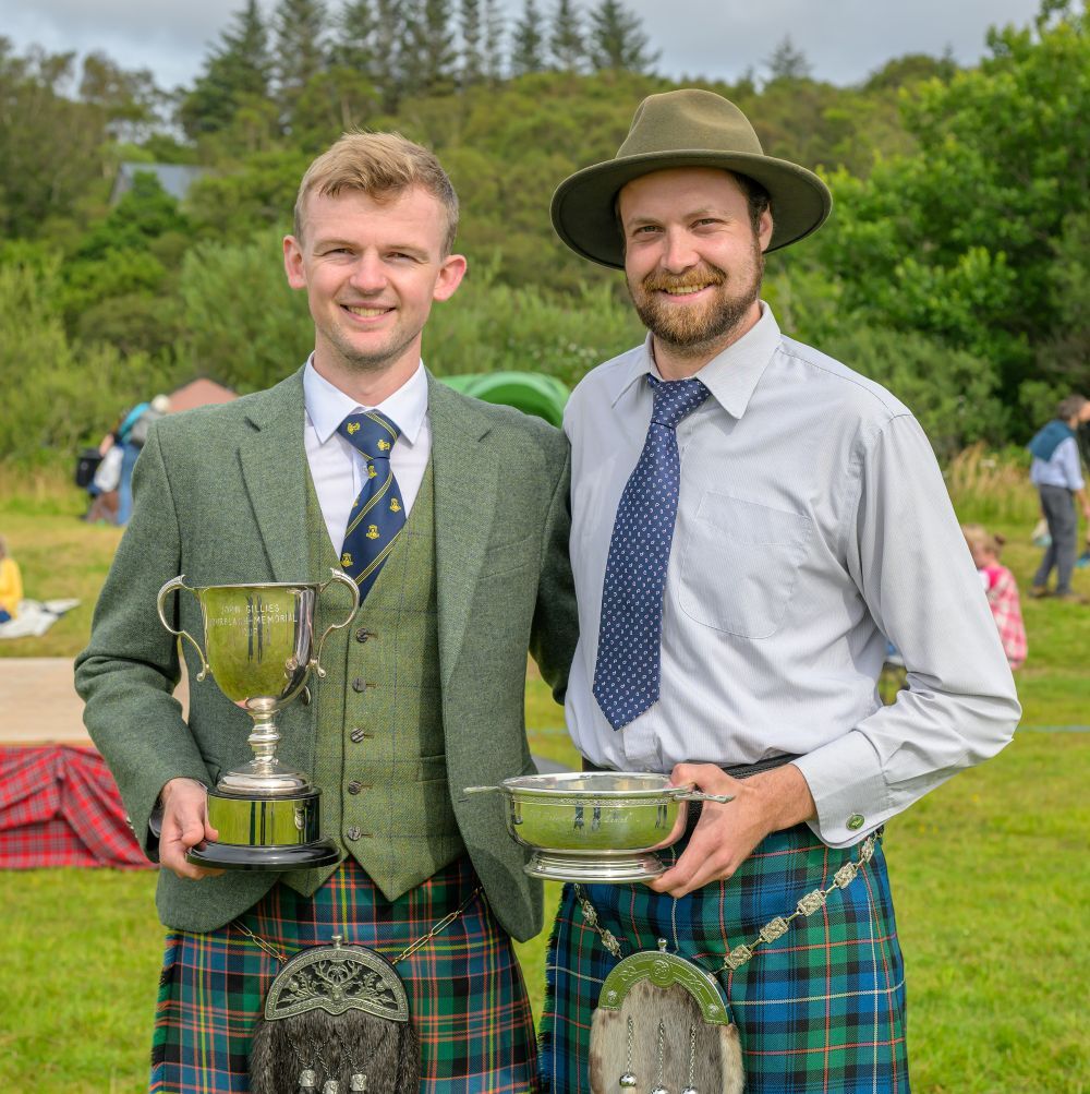 Sandy Cameron of Inverlair with the John Gillies Bourblach Memorial cup (Piobaireachd) and Calum Carn with the Alisdair Roberts Memorial Quaich. Photograph: Phil Hughes.