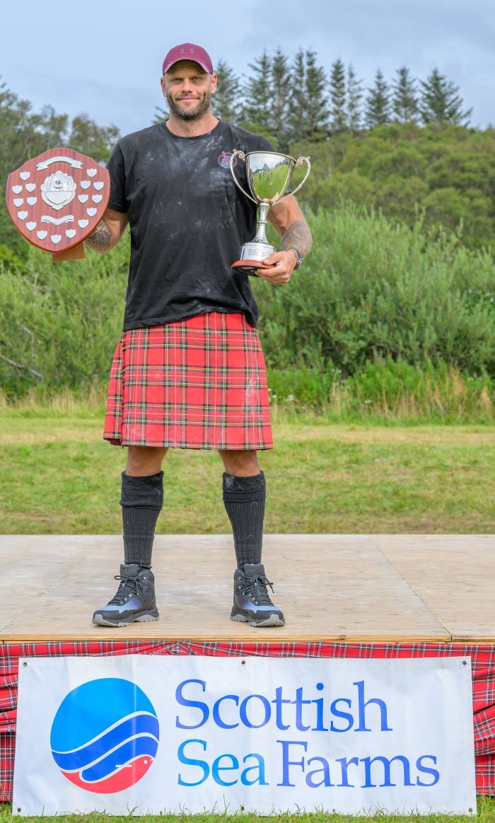 Record breaker Vladislav Tulacek with the Gerard MacDonald trophy (Caber) and Big Mac Cup (Heavies overall winner). Photograph: Phil Hughes.