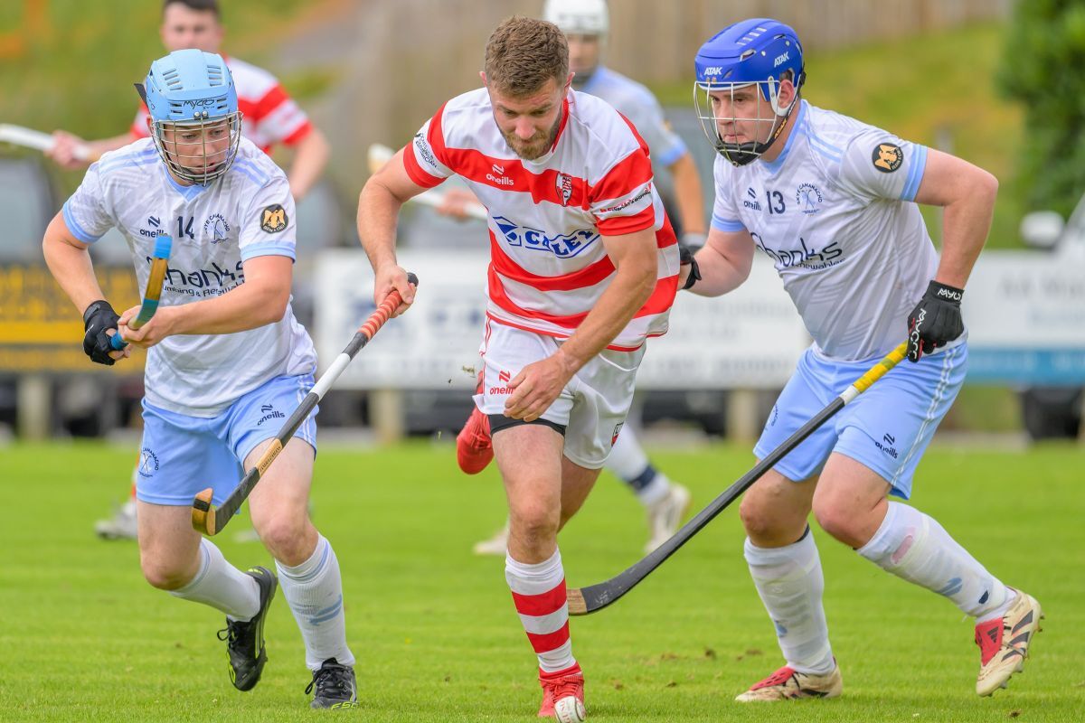 Martin Johnstone (Lochaber) breaks through the Skye midfield. Photograph: Phil Hughes.