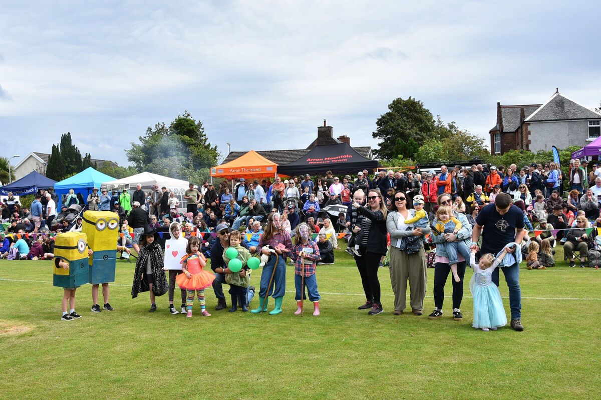 Fancy dress entrants, including winners Clarkson’s Farm, Minions, and Peas in a Pod, pose for the competition judges.