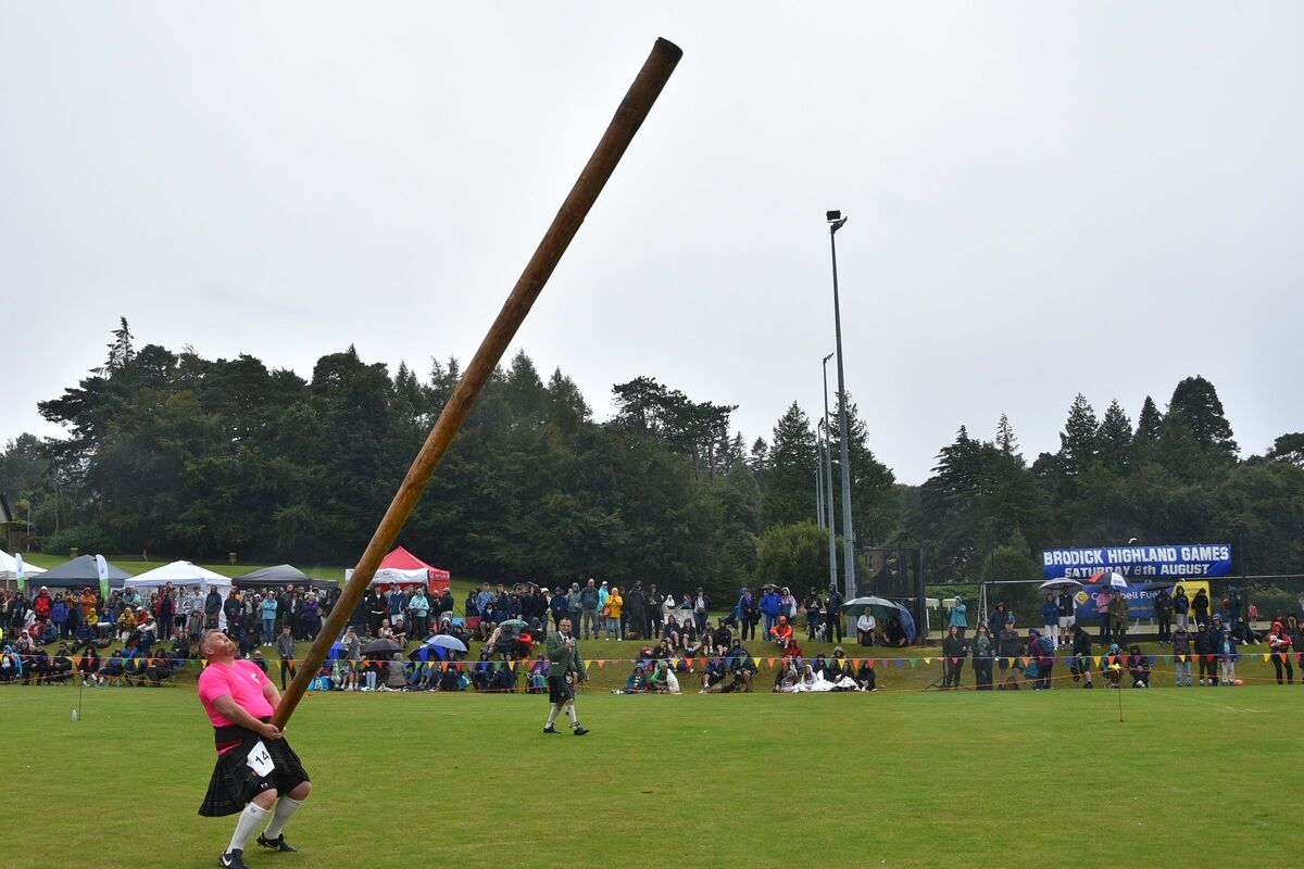 Brian Docherty of Clydebank launches the caber into the air. Brian Docherty of Clydebank launches the caber into the air.