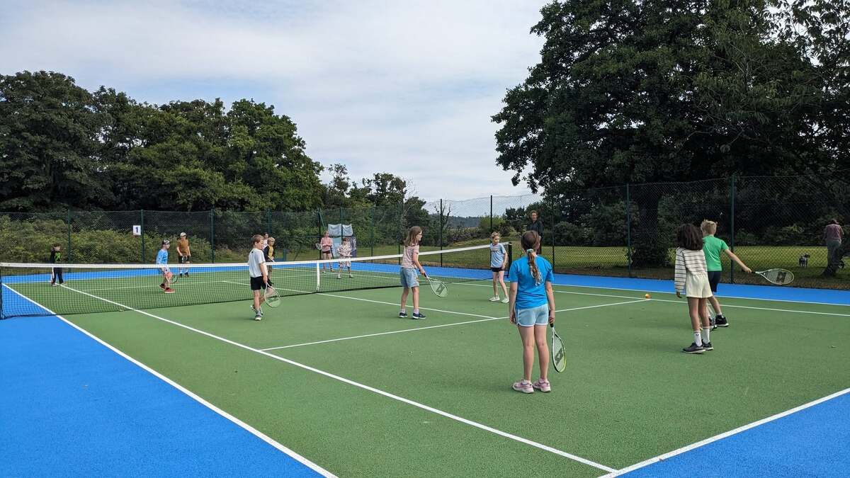 Children enjoy a game of ‘wipe out’. Photograph: Brodick Tennis Club. Children enjoy a game of ‘wipe out’. Photograph: Brodick Tennis Club.