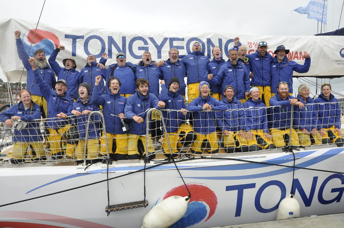 The Tongyeong Clipper Crew celebrate their Silver victory coming into Oban in 2nd place. Lauren pictured bottom row 4th from left