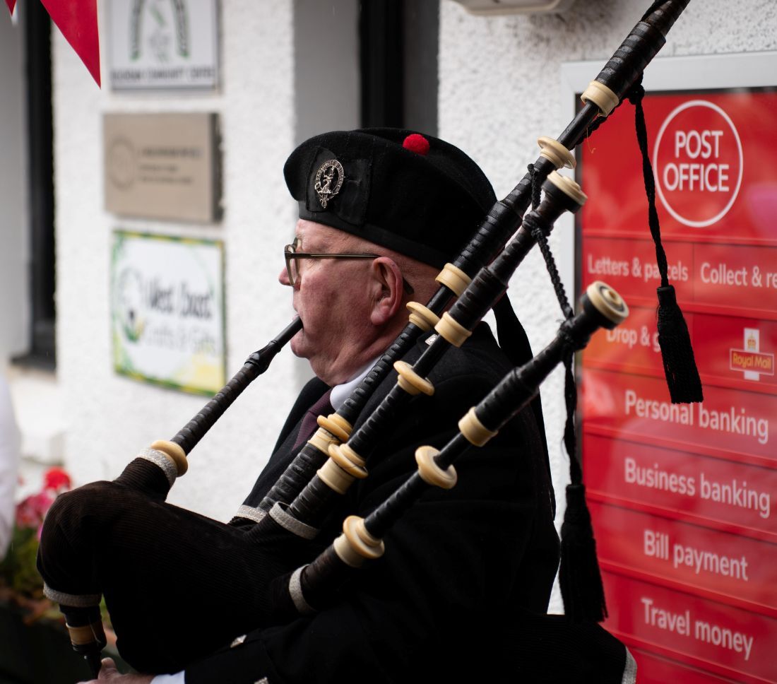 Former postmaster David Doherty played a tune on the pipes to mark the occasion. Photograph: Jez Campbell.
