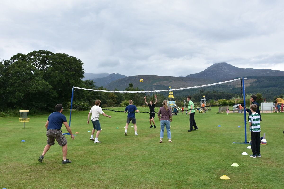 Volleyball players compete in the finals of the volleyball competition.