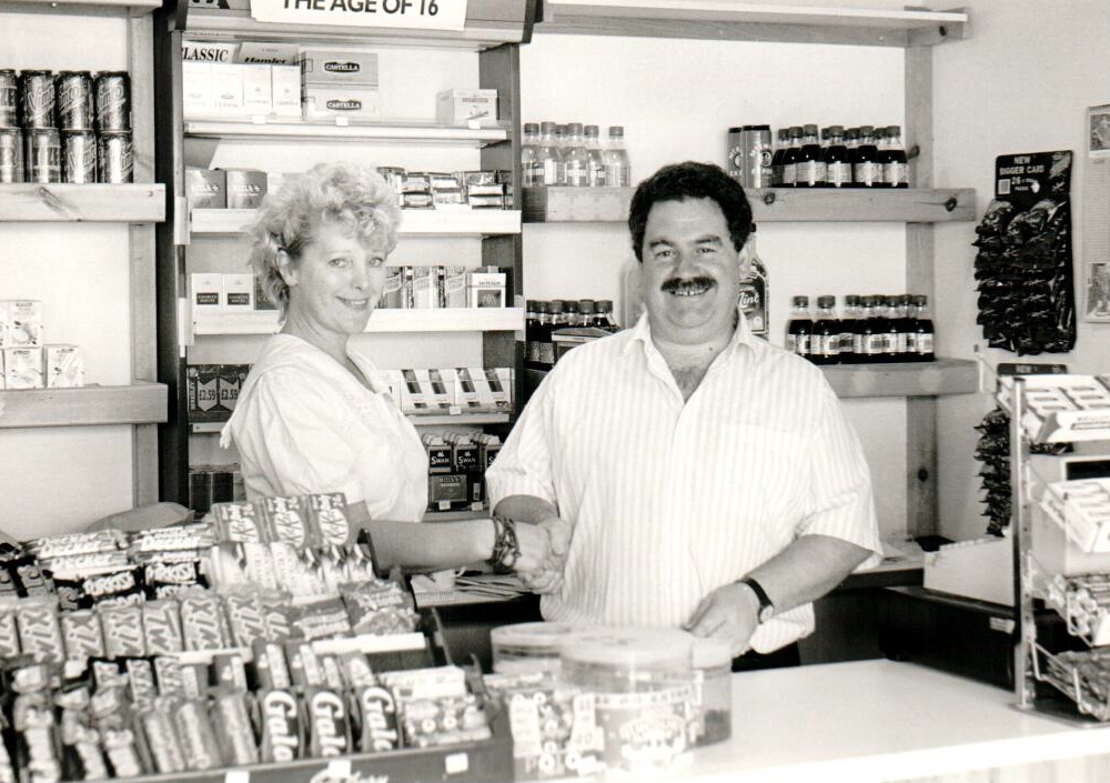 Carole Beardsley hands over the keys to Corrie Post Office and general store to new owner Drew Crawford who will be taking over the operation.