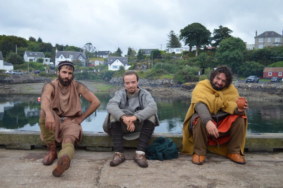 Three members of the Brioc crew, dressed in historically inspired clothing, during the vessel’s stop at Carradale. Photograph: Kyle Gosling.