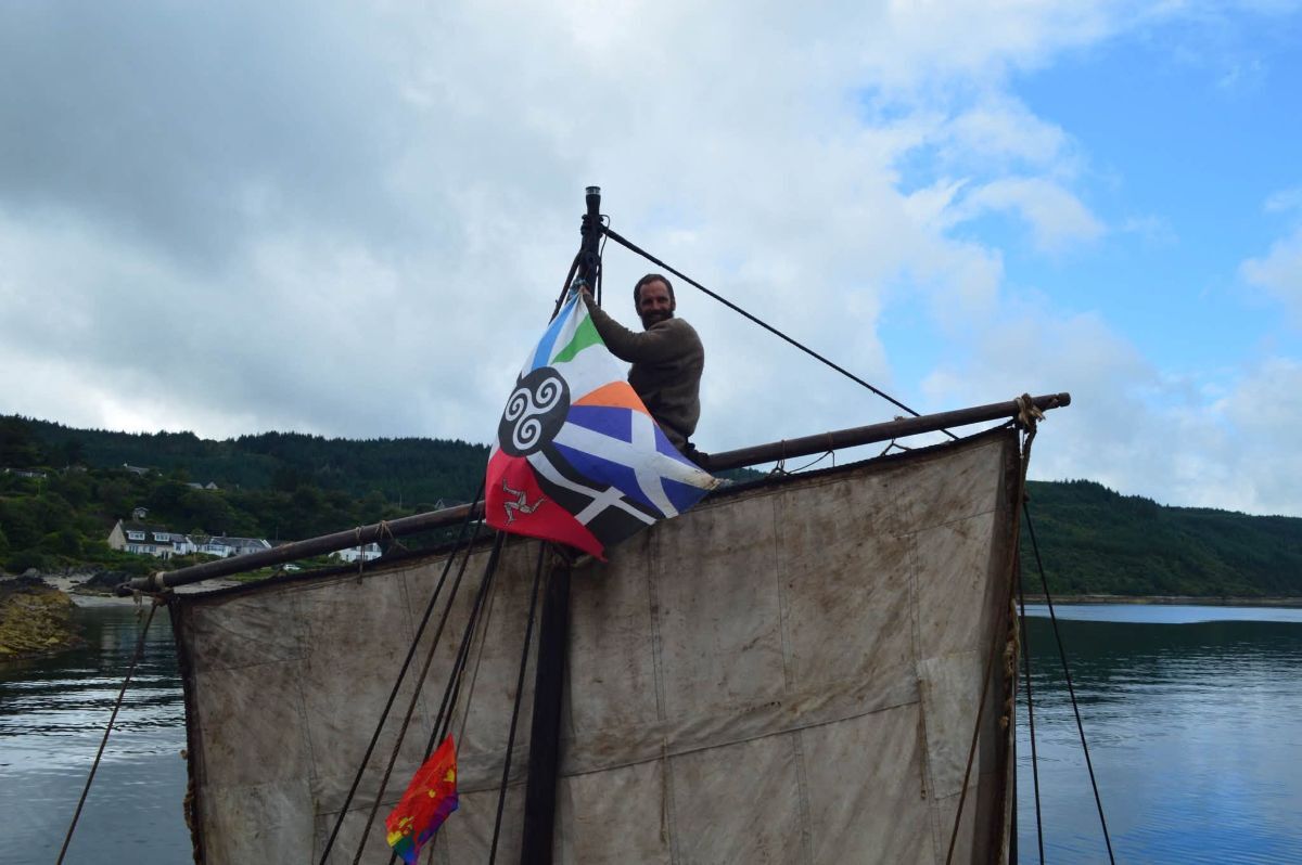 Captain Ingwenog Jaouen displays a flag representing the Celtic nations. Photograph: Kyle Gosling.