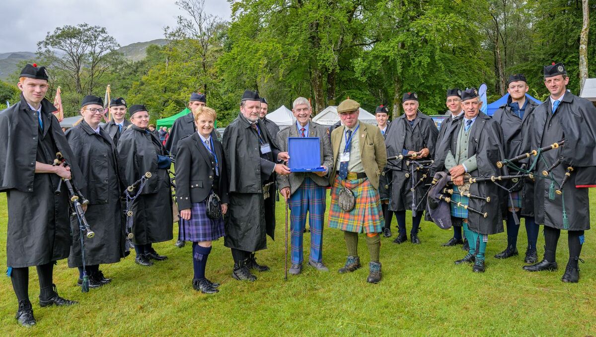 WEB NO F34 Glenfinnan Gathering 26 Iain MacFadyen presented with a silver plate by Colin Macbeath PH