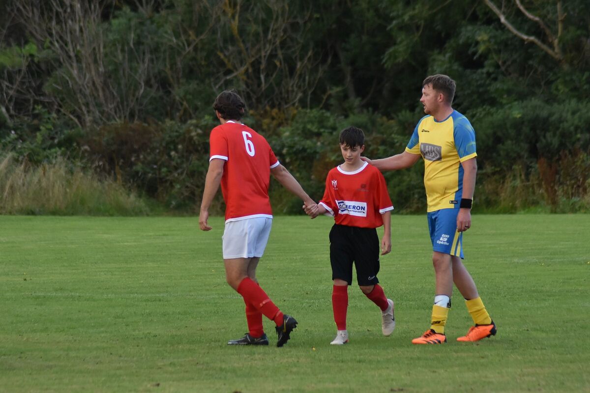 Players from both teams congratulate Arran’s youngest player, Harrison Sturgeon, who scored a goal for Shiskine. Players from both teams congratulate Arran’s youngest player, Harrison Sturgeon, who scored a goal for Shiskine.
