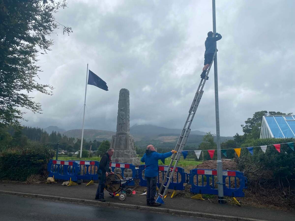 Volunteers take down the village bunting after a successful Brodick Highland Games. Volunteers take down the village bunting after a successful Brodick Highland Games.