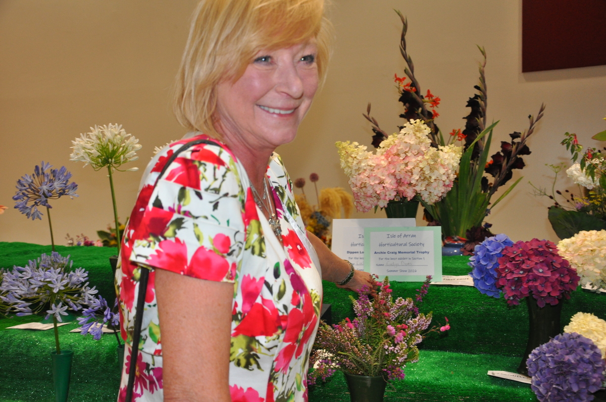 Baking section judge, Evelyn Davis, was delighted to discover she had won the prize for the best exhibit overall in the cut flower section.