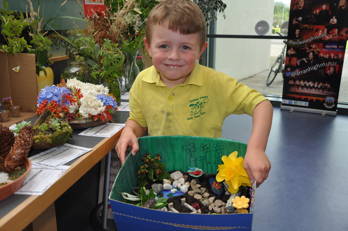 Mason Ward with his entry in the children’s miniature garden class.