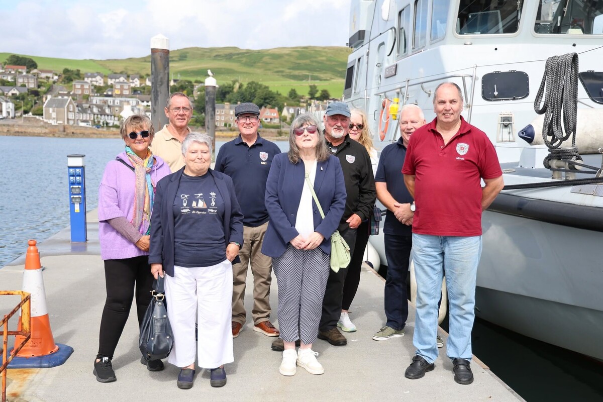 Kintyre Veterans members alongside HMS Biter during the Royal Navy vessel’s visit to Campbeltown. 