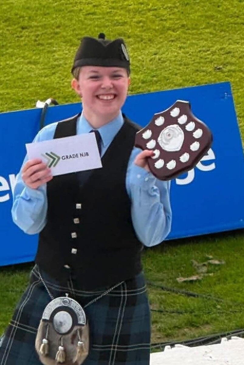 KSPB member Hannah Millar shows off a shield after the band’s strong performance at the World Pipe Band Championships. KSPB member Hannah Millar shows off a shield after the band’s strong performance at the World Pipe Band Championships.