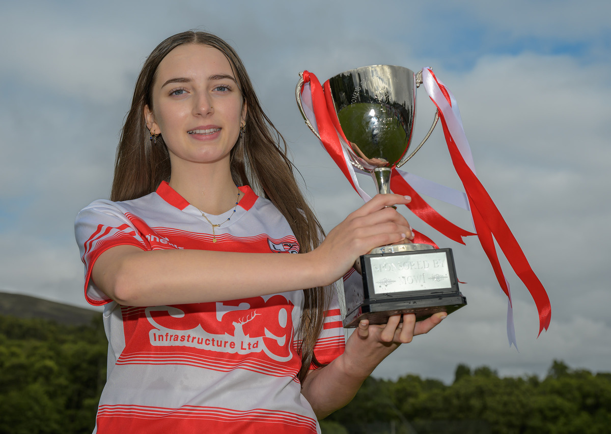 NO PH L35 Lochaber Ladies II team captain Millie Anderson holds aloft the Mowi North Division league trophy NO PH L35 Lochaber Ladies II team captain Millie Anderson holds aloft the Mowi North Division league trophy