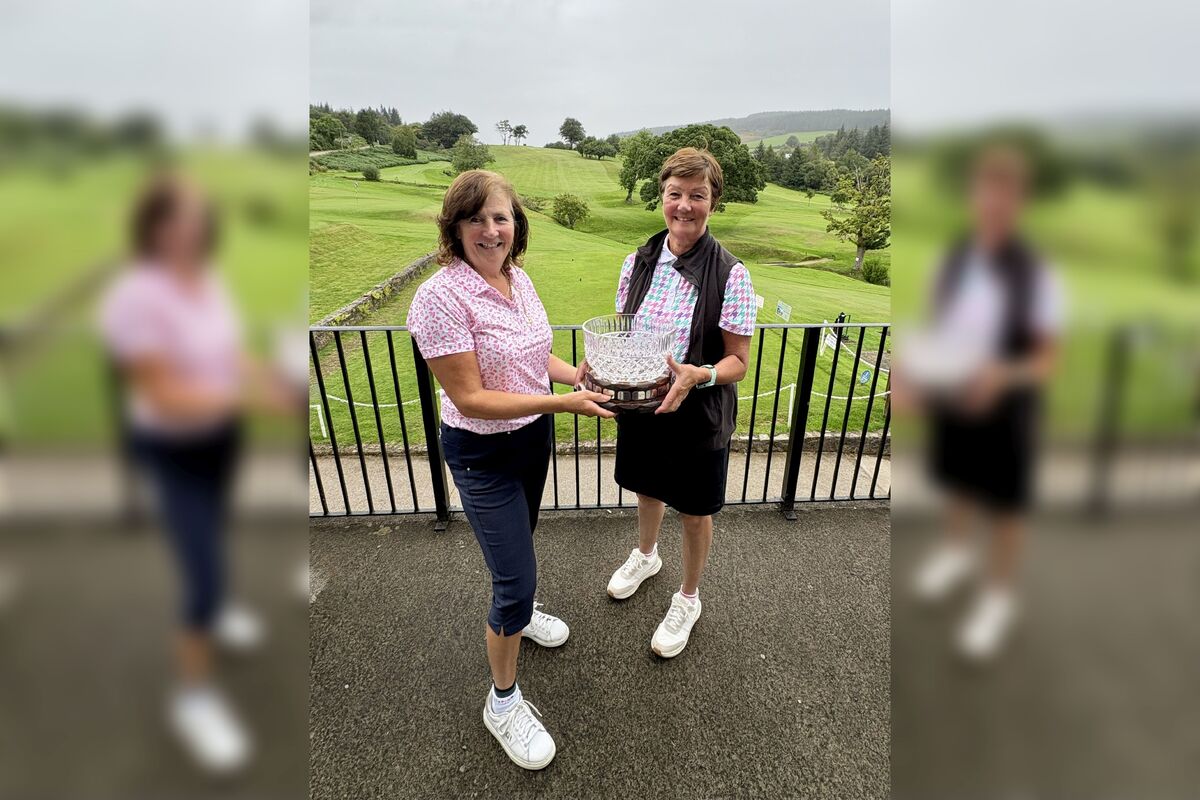 Lynda Blair being presented with the Jose Sanderson Stableford Trophy by Lamlash lady captain Fiona Drennan. Photograph: LGC. 