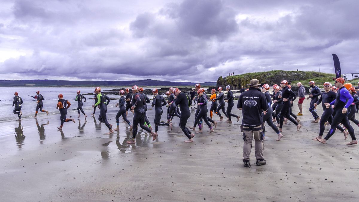 Competitors enter the water at the start of the race. Photograph: John Coffield. Competitors enter the water at the start of the race. Photograph: John Coffield.