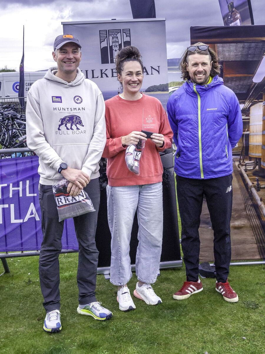 Members of relay winners Latecomers celebrate their victory. Photograph: John Coffield. Members of relay winners Latecomers celebrate their victory. Photograph: John Coffield.