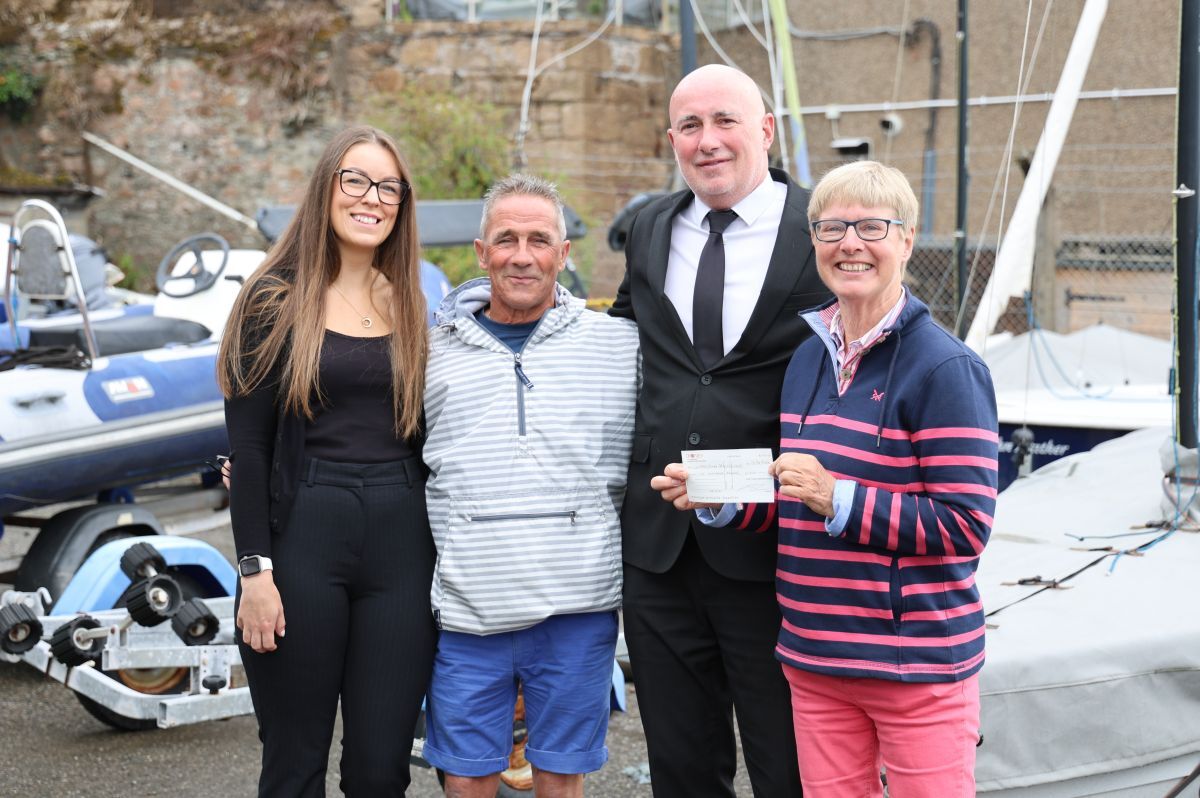 From left: Kelly Grogan, Jamie MacLean and Kenny Blair present a cheque for £1,000 to Campbeltown Sailing Club treasurer Judy Orr.
