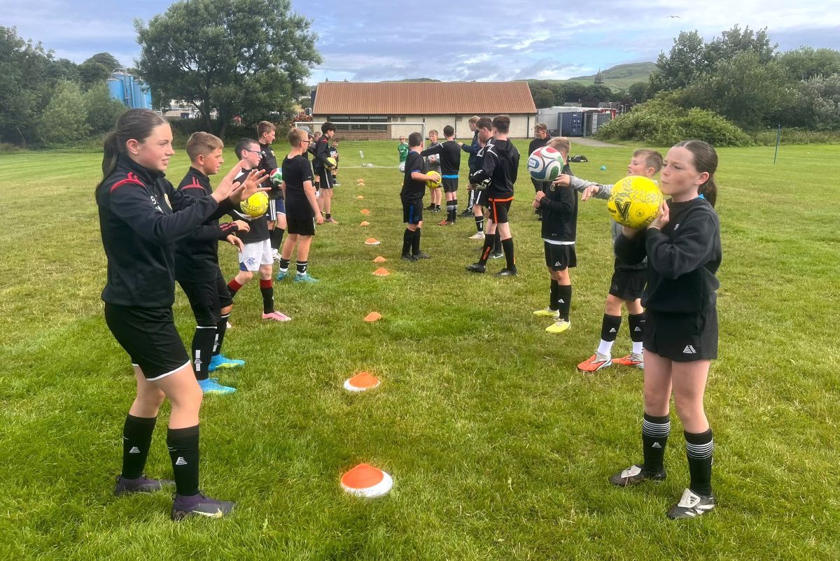 Young players put their ball-control skills to the test during a CDJFA Summer of Sport session. Young players put their ball-control skills to the test during a CDJFA Summer of Sport session.