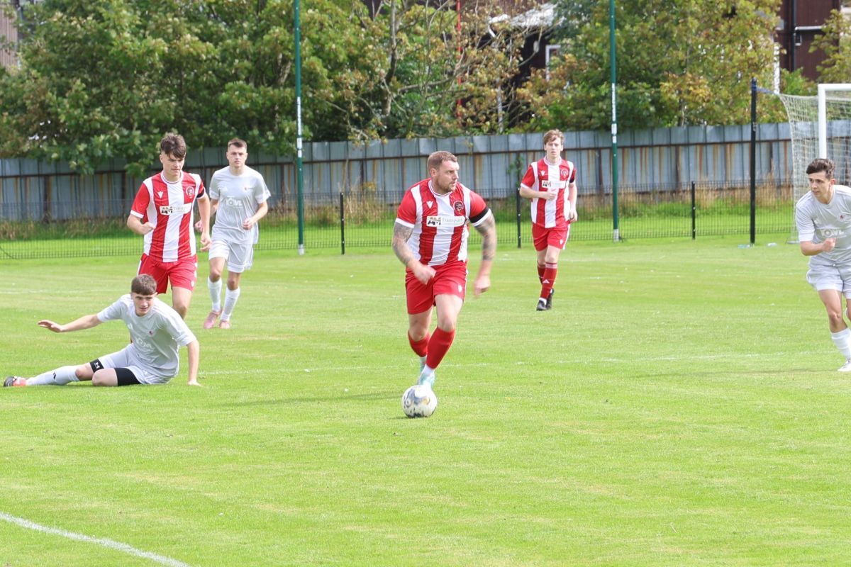Craig Morris drives forward for Campbeltown Pupils against Longside. Photograph: Kenny Craig.