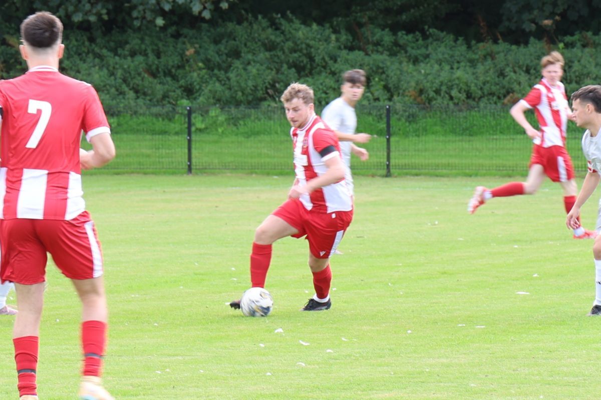 Gregor McGeachy looks to find a pass for the Pupils. Photograph: Kenny Craig.