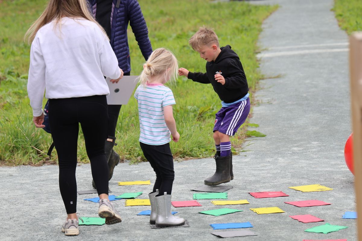 Children enjoying games during the community opening celebration. Photograph: Kenny Craig.