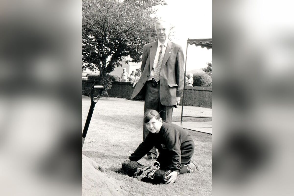 Arran High School rector Iain Murray watches as Laura Bunyan buries a time capsule for pupils to dig up in 2046 when the school will be 100 years old.