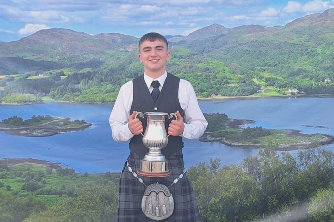 Rio Arkell proudly lifts the Burgh Cup, a trophy previously won by both his grandfather and great-grandfather.